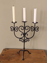 Load image into Gallery viewer, black metal candlestick holder on wooden shelf
